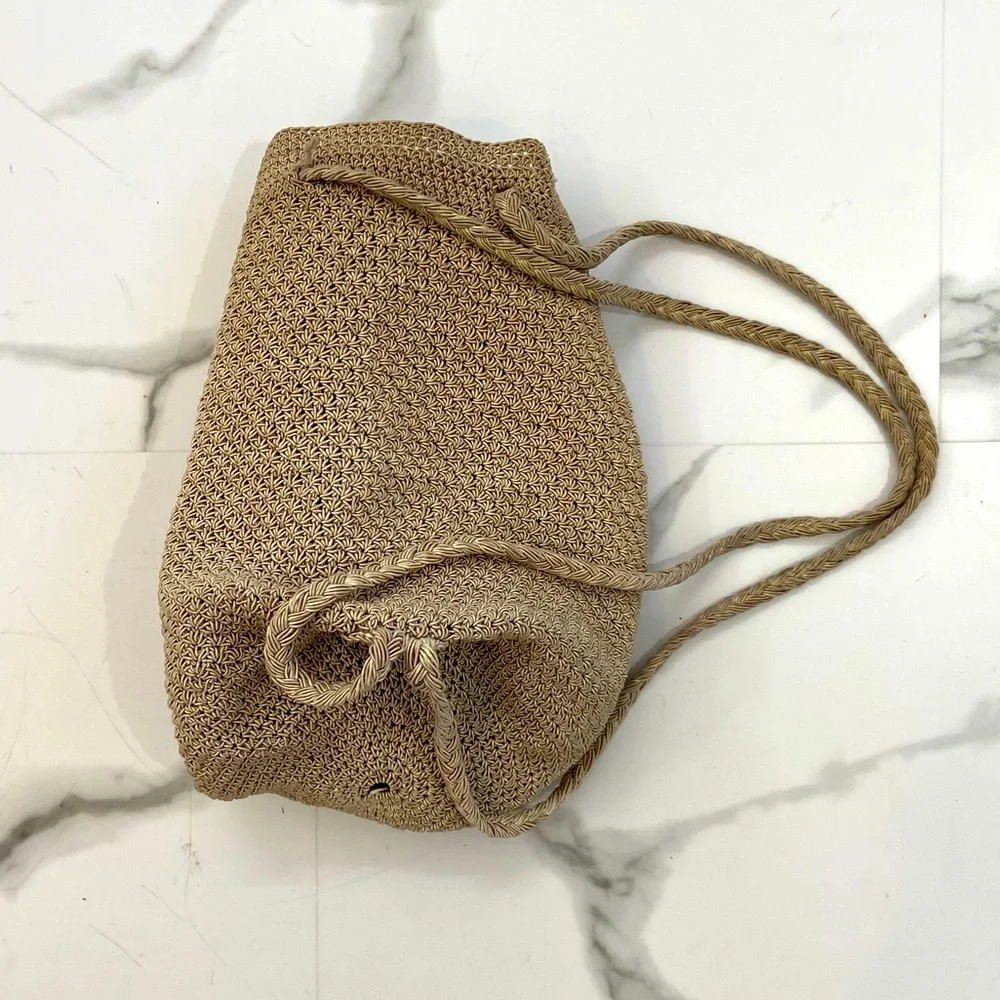 Woven-style backpack. Medium size & tan color. My favorite go-to bag. 11 inches
